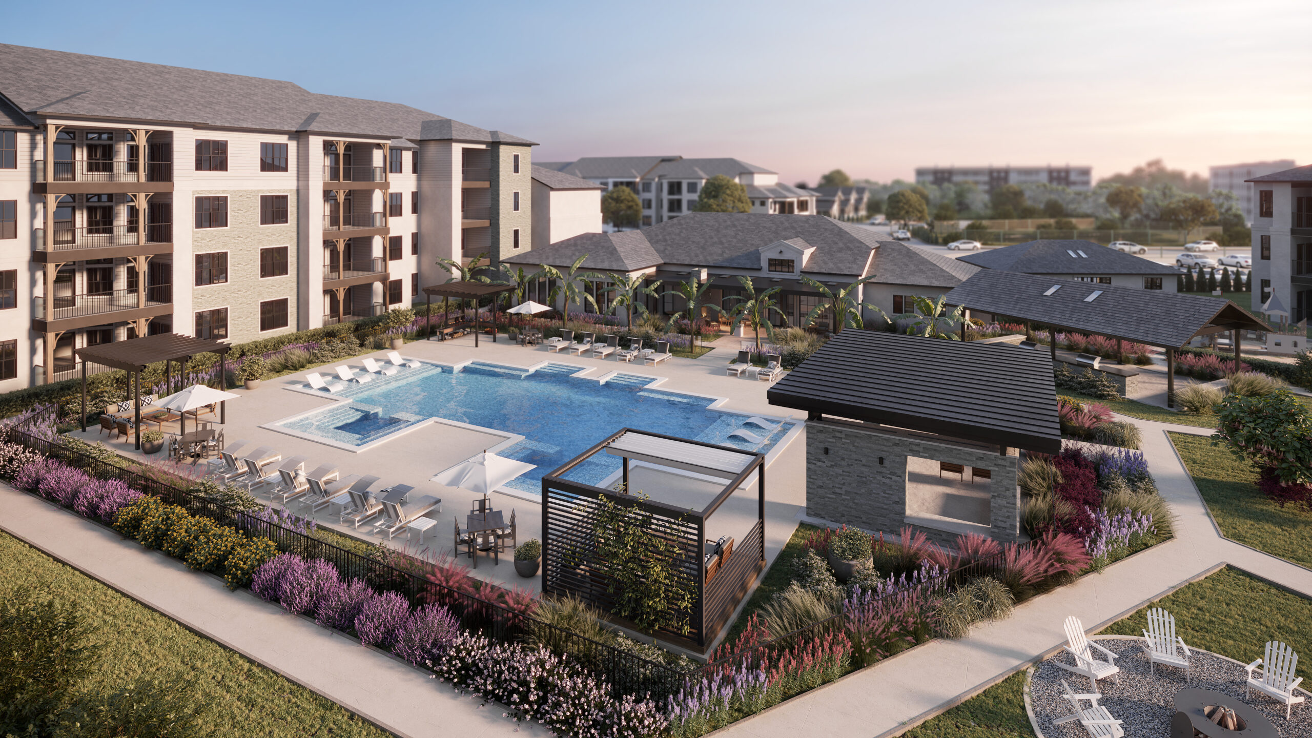 Shot overlooking a resort style pool with loungers and cabanas, surrounded by colorful landscaping and cream apartment buildings